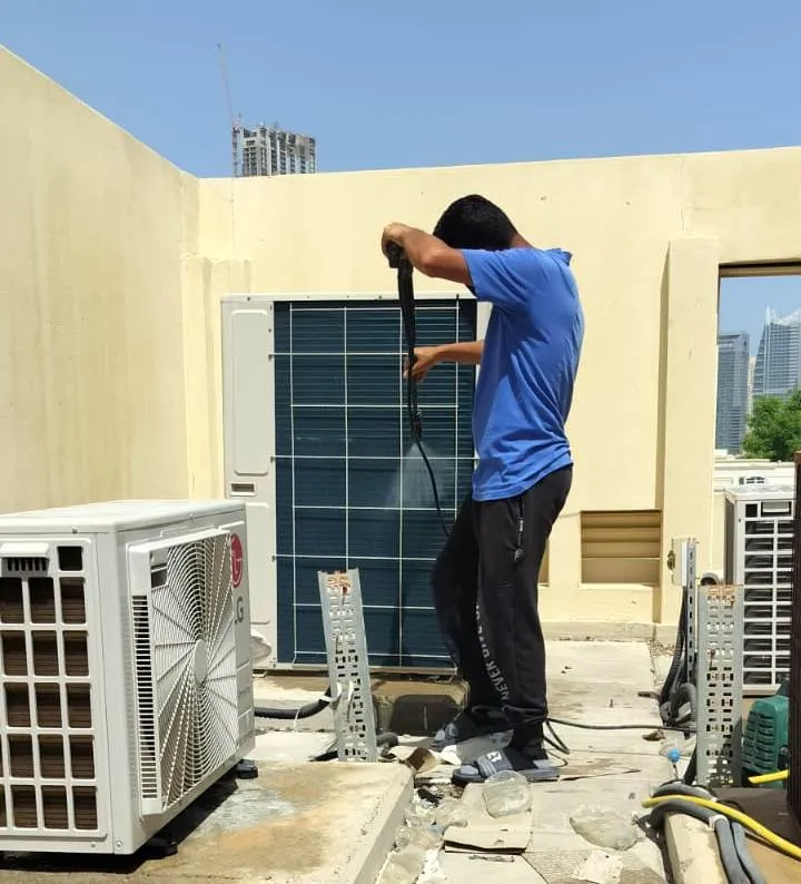 "Cleaning outdoor AC filter"